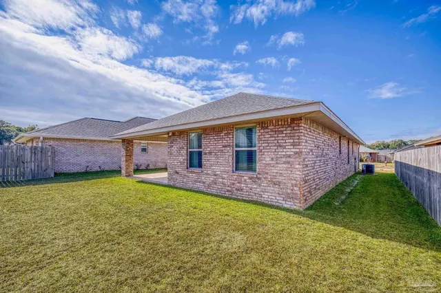 a front view of house with yard and porch