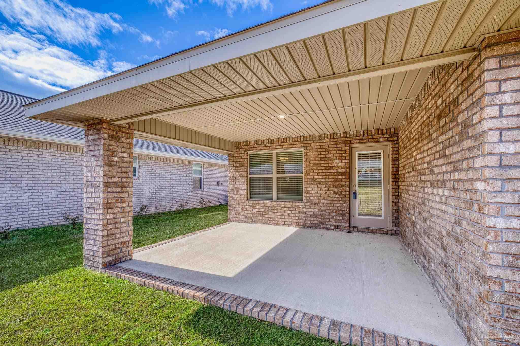 4442 Fiske Street Pace, FL 32571 - Photo 4 of 44 a view of a backyard with a garden