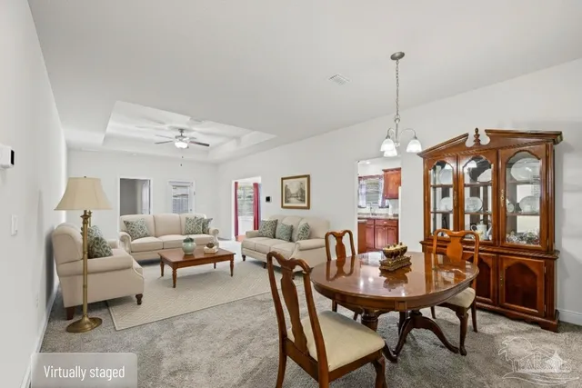 a view of a livingroom with furniture and window