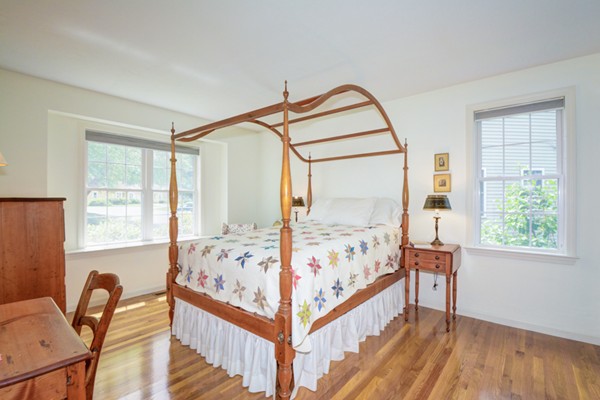 99 Stow Road, Unit 99 Boxborough, MA 01719 - Photo 14 of 27 a view of a bedroom with furniture and windows