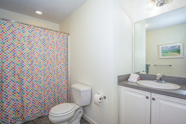 99 Stow Road, Unit 99 Boxborough, MA 01719 - Photo 16 of 27 a white toilet sitting next to a bathroom sink