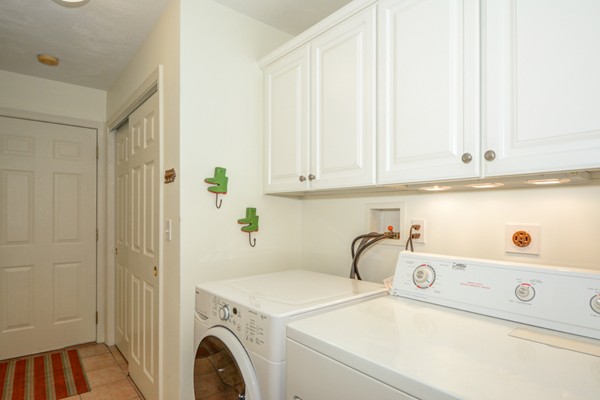99 Stow Road, Unit 99 Boxborough, MA 01719 - Photo 17 of 27 a utility room with dryer and washer