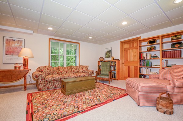 99 Stow Road, Unit 99 Boxborough, MA 01719 - Photo 18 of 27 a living room with furniture rug and window