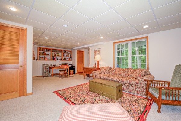 99 Stow Road, Unit 99 Boxborough, MA 01719 - Photo 19 of 27 a bed room with furniture and a window