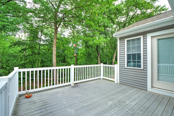 99 Stow Road, Unit 99 Boxborough, MA 01719 - Photo 23 of 27 a view of a wooden deck