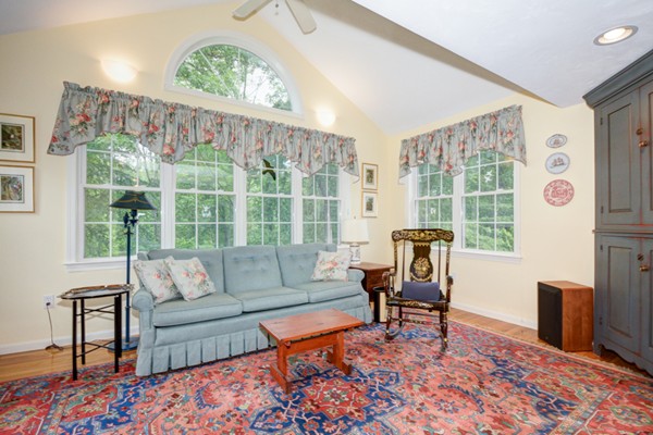 99 Stow Road, Unit 99 Boxborough, MA 01719 - Photo 9 of 27 a living room with furniture and a window