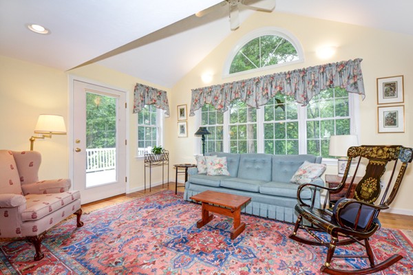 99 Stow Road, Unit 99 Boxborough, MA 01719 - Photo 10 of 27 a living room with furniture and a large window