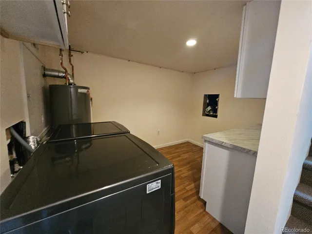 a utility room with sink dryer and washer