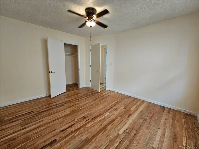 a view of backyard with table and chairs and potted plants
