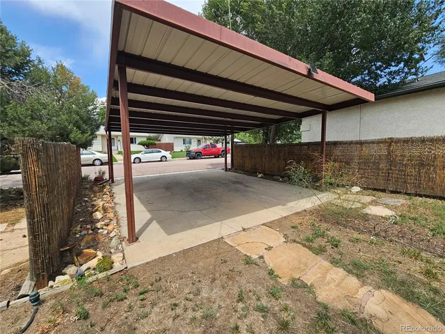 a view of backyard and basketball area