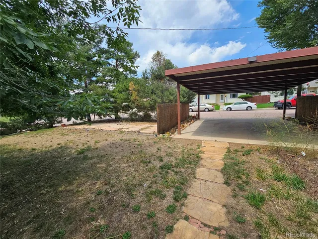 a house view with a backyard space