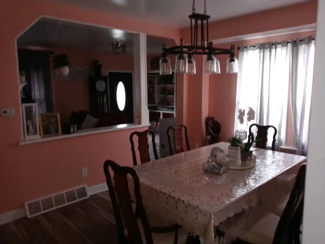 a view of a dining room with furniture and window