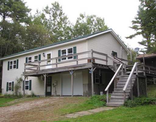 156 Town House Road Chelsea, ME 04330 - Photo 15 of 22 Exterior Front. Wrap around deck