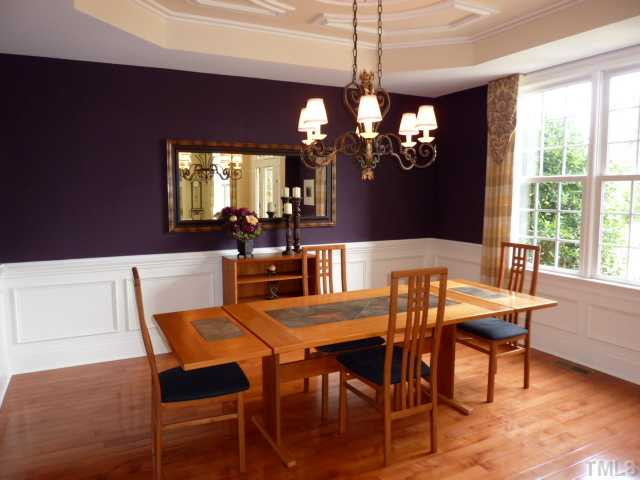 12301 Bunchgrass Lane Raleigh, NC 27614 - Photo 5 of 19 Serve more formal meals in the separate Dining Room with HARDWOOD flooring, trey ceiling and wainscopting. You'll love the elegant ambiance of this room. Dining Room