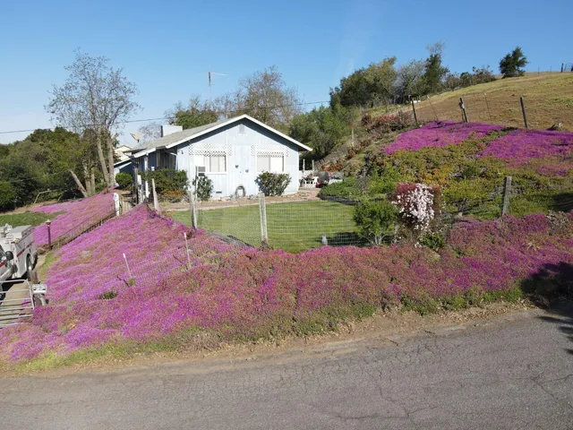 a view of a house with a street
