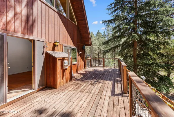 a view of balcony with wooden floor and outdoor space