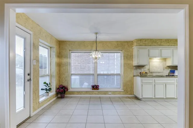 a bathroom with a sink vanity mirror and toilet
