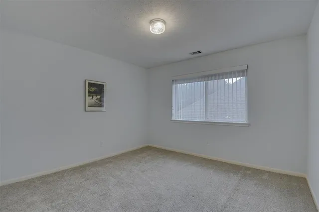 a bathroom with a double vanity sink toilet and a mirror
