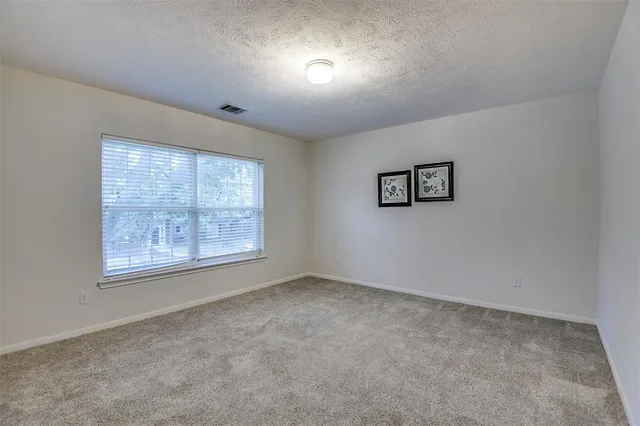 a view of cabinets and wooden floor