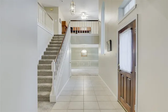 a view of entryway and hall with a front door