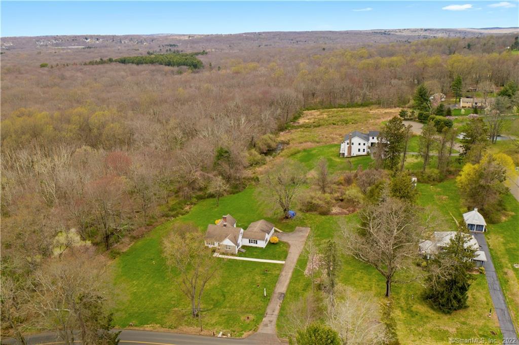 1050 Orange Center Road Orange, CT 06477 - Photo 1 of 1 a view of residential houses with lake view