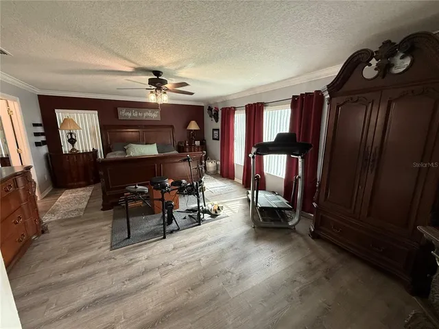 a view of a livingroom with furniture and a window