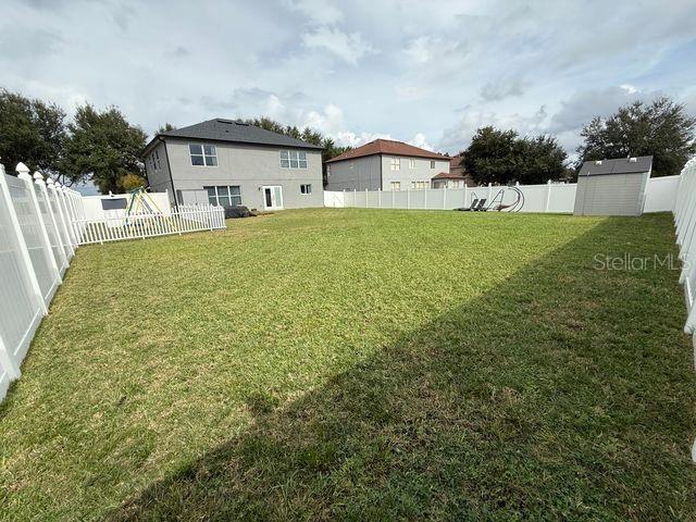 4780 Barbados Loop Clermont, FL 34711 - Photo 23 of 23 a house view with a garden space