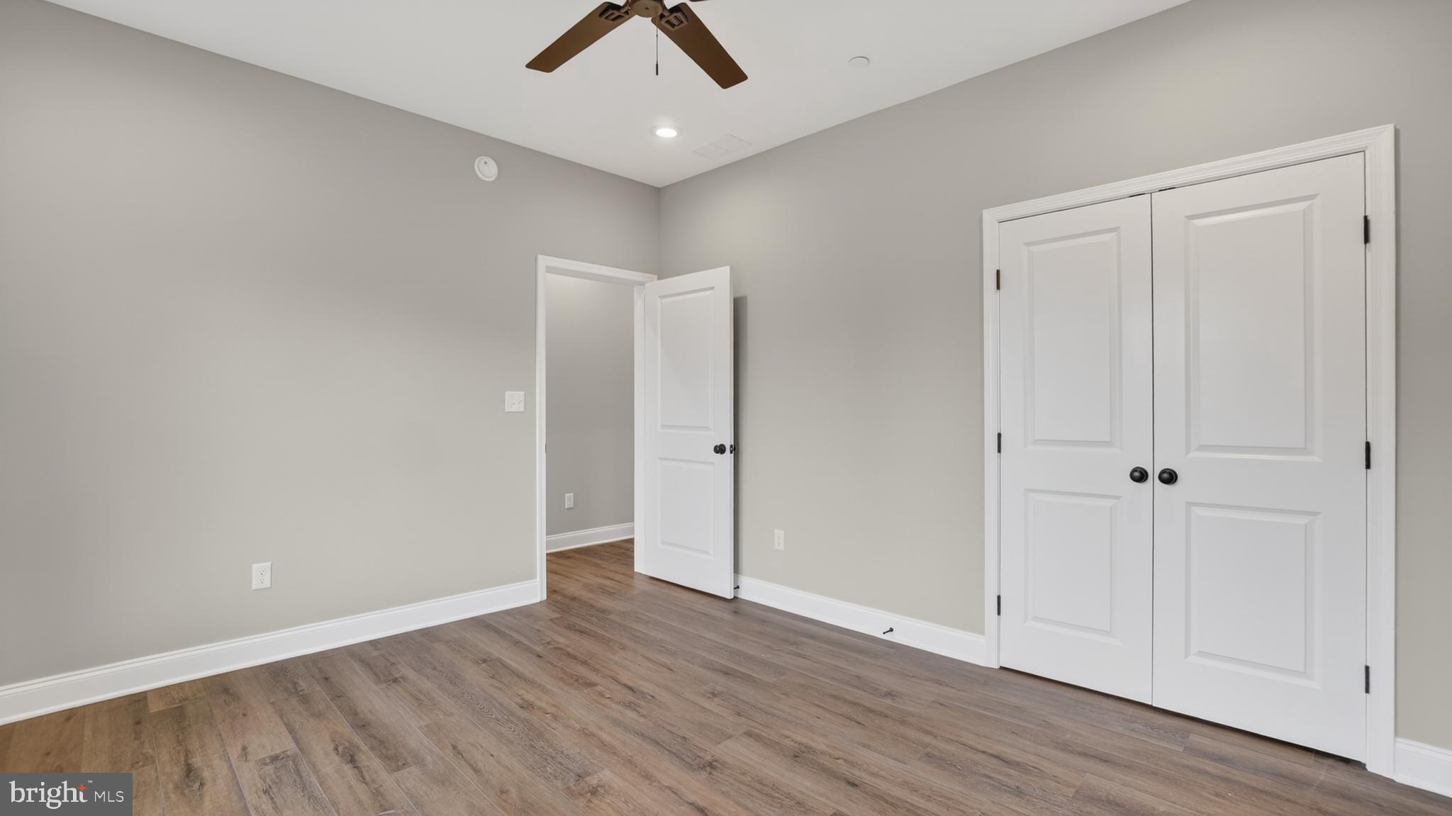2001 Poplar Ridge Road Pasadena, MD 21122 - Photo 43 of 83 an empty room with wooden floor and windows