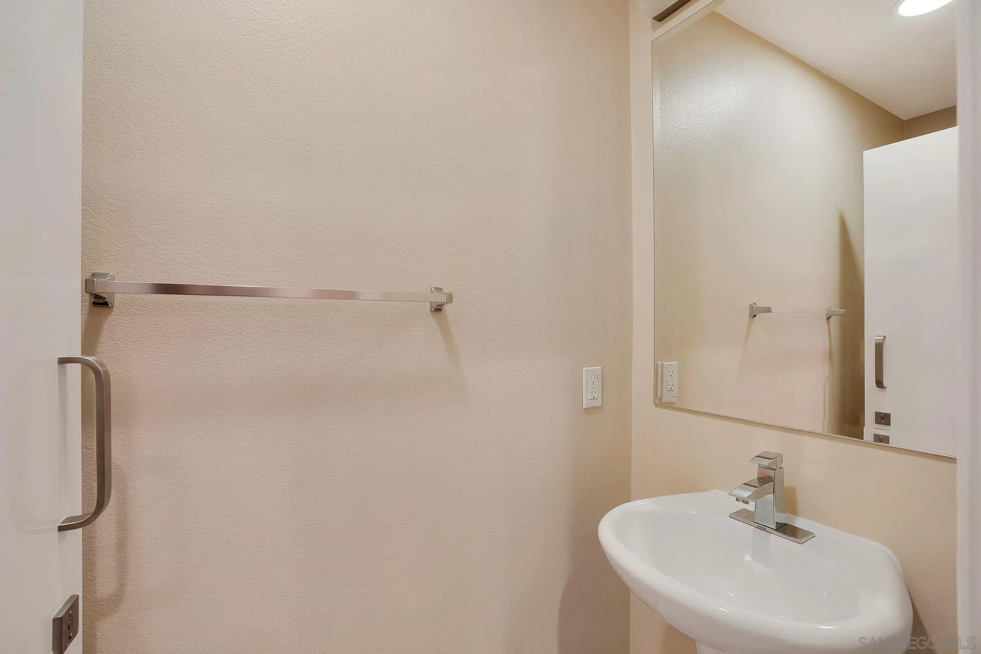 2236 Indus Way San Marcos, CA 92078 - Photo 12 of 30 a bathroom with a sink and a mirror