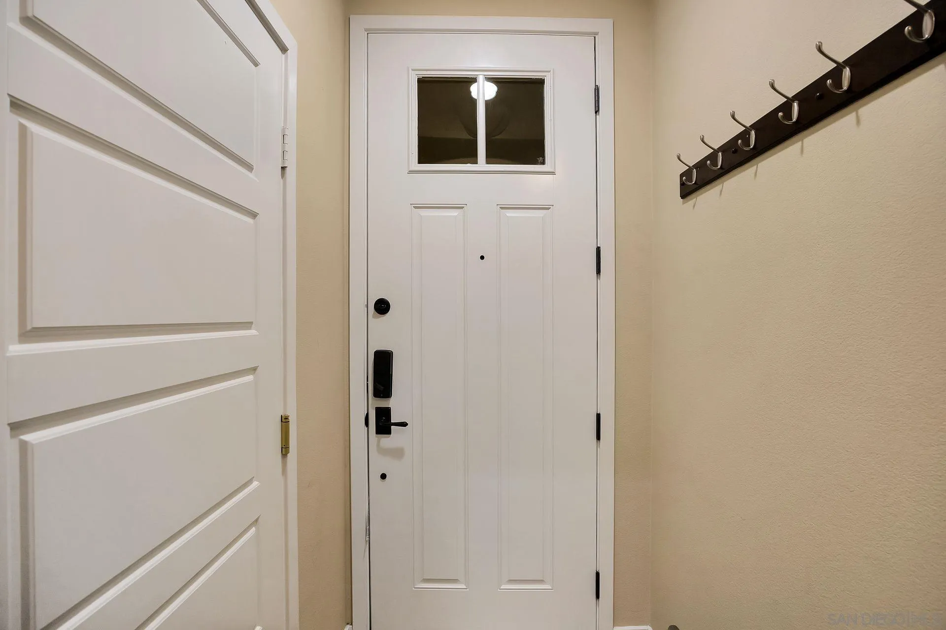 2236 Indus Way San Marcos, CA 92078 - Photo 22 of 30 a view of a hallway with wooden cabinets