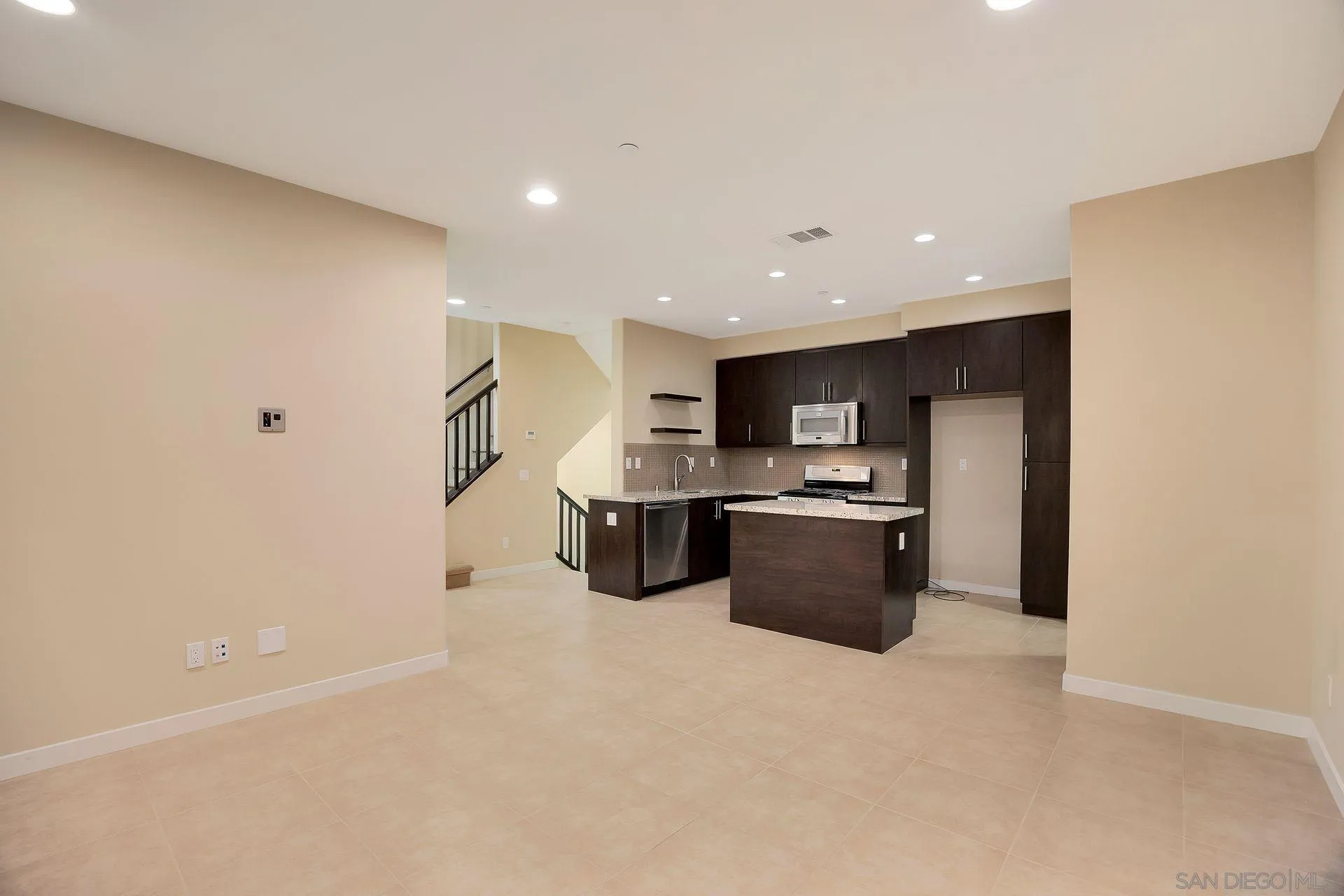 2236 Indus Way San Marcos, CA 92078 - Photo 6 of 30 a kitchen with stainless steel appliances a refrigerator a stove top oven and oven