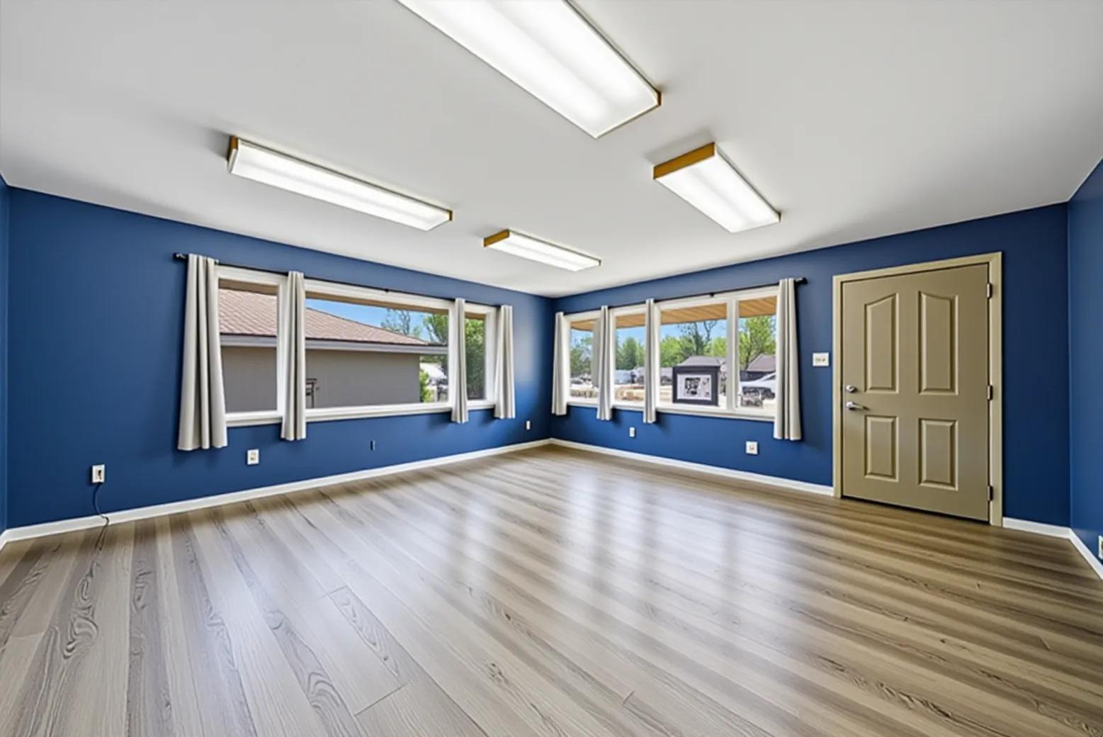 2304 Plainfield Road Crest Hill, IL 60403 - Photo 4 of 56 a view of an empty room with wooden floor and a window