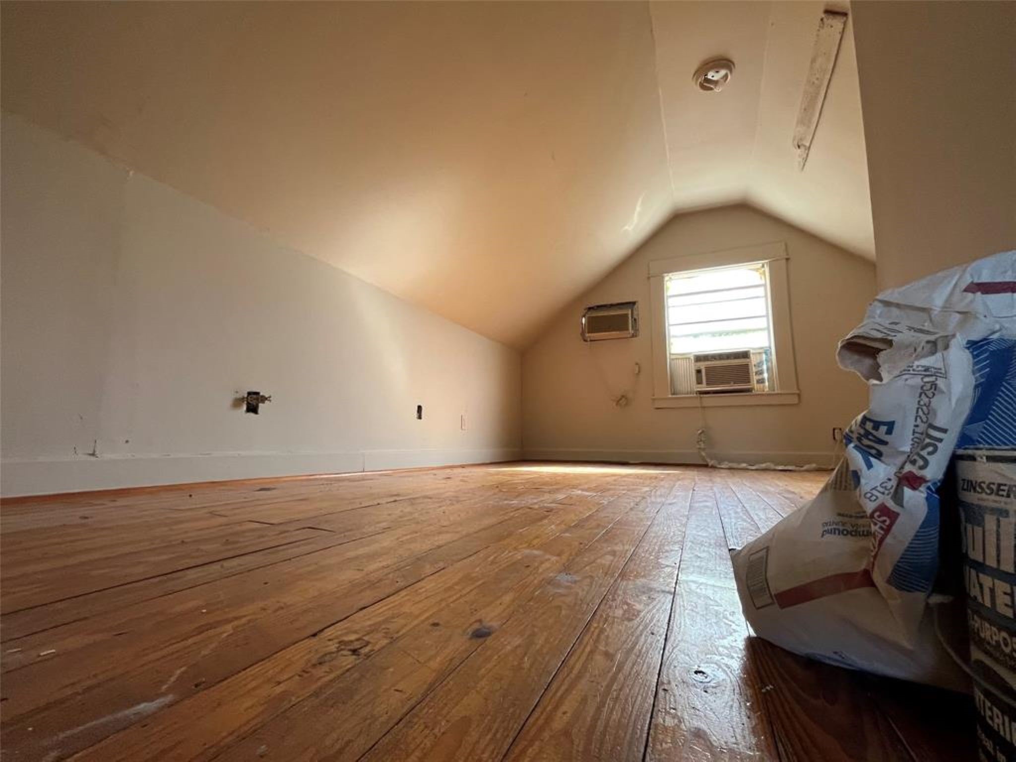 11712 FM 1458 Road Sealy, TX 77474 - Photo 11 of 13 a view of an empty room with wooden floor and a window