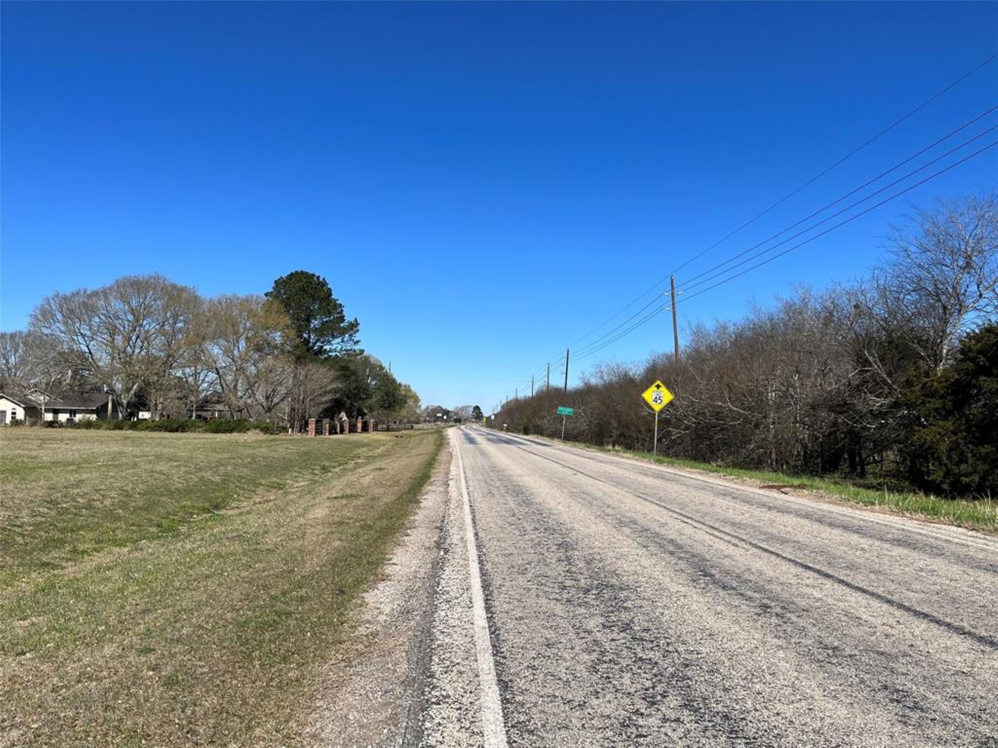 11712 FM 1458 Road Sealy, TX 77474 - Photo 12 of 13 a view of a road with a yard