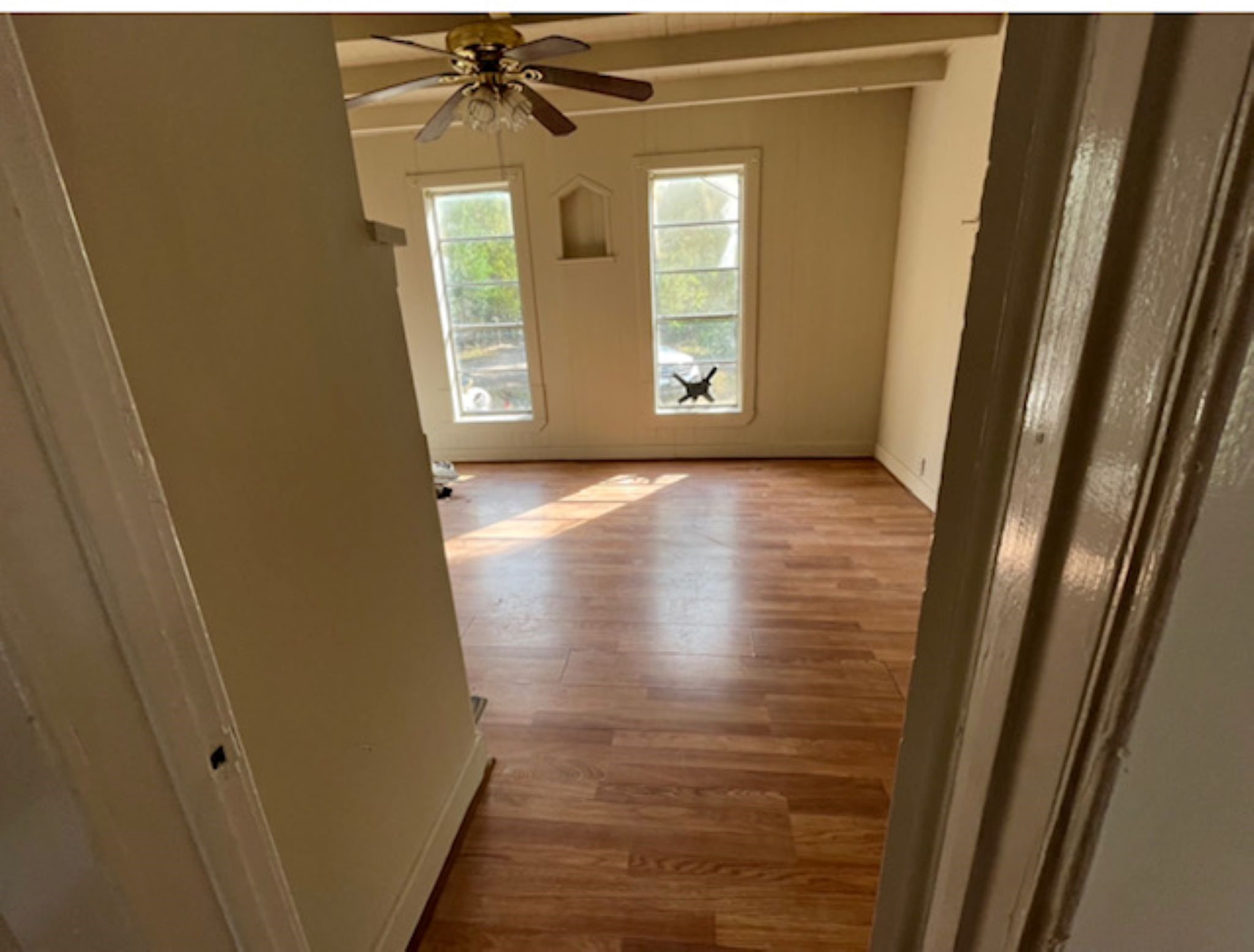 11712 FM 1458 Road Sealy, TX 77474 - Photo 9 of 13 a view of an empty room with wooden floor and a window