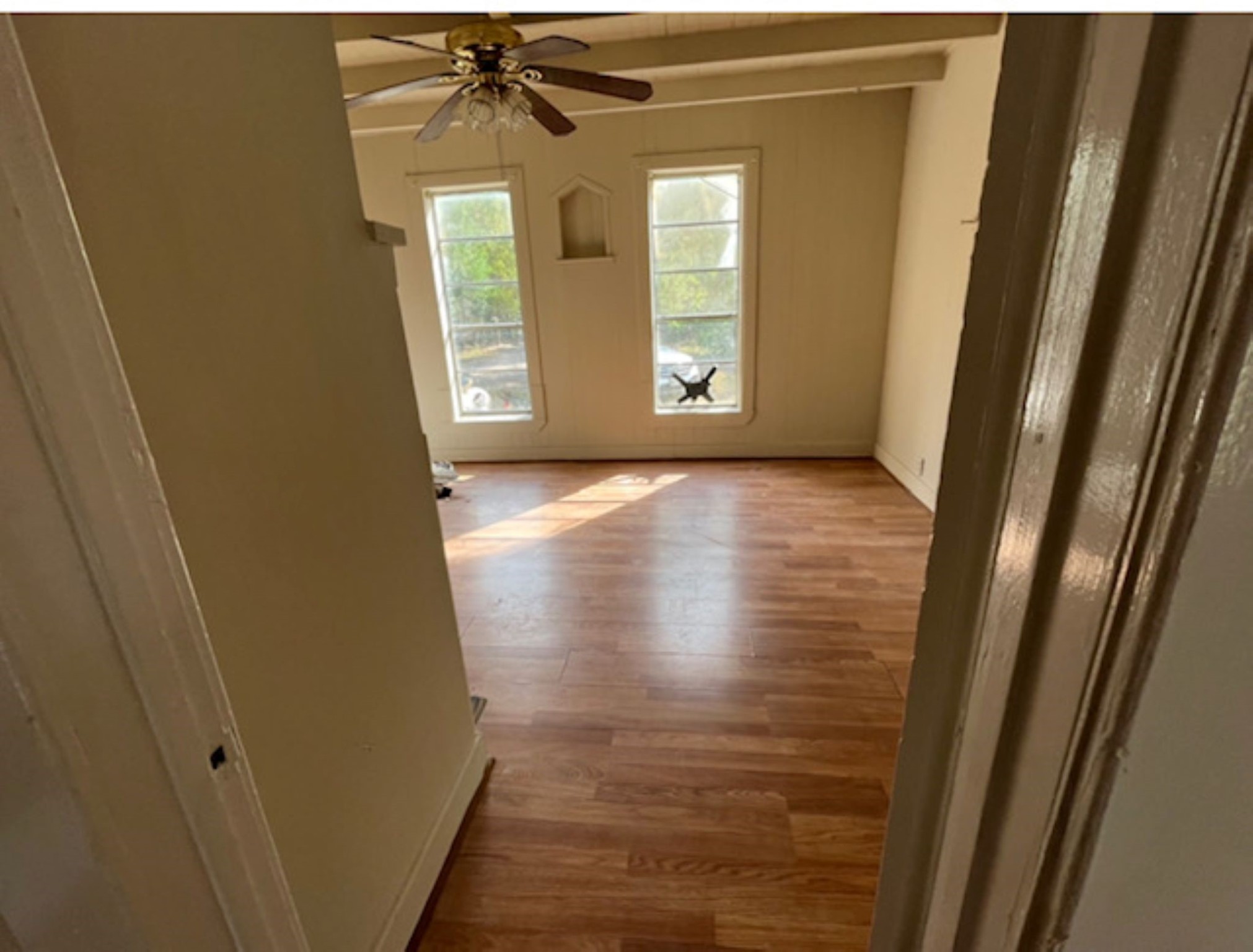11712 FM 1458 Road Sealy, TX 77474 - Photo 9 of 13 a view of an empty room with wooden floor and a window