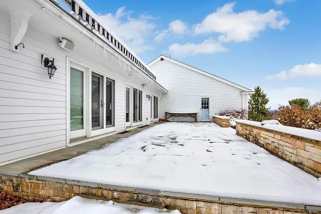 a view of a kitchen with a stove top oven