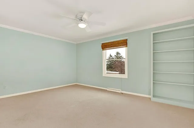 a white toilet sitting next to a shower curtain
