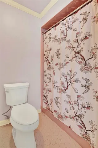 an empty room with a ceiling fan and a window