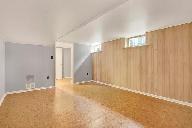 a bathroom with a sink a toilet a mirror and shower