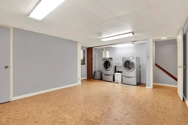 a view of an empty room with a chandelier