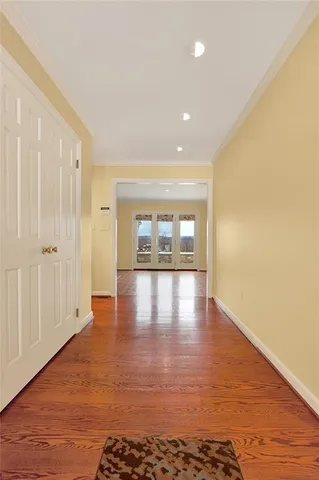 a kitchen with stainless steel appliances kitchen island granite countertop a stove a sink and a wooden cabinets