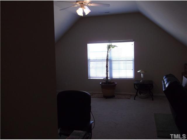 1124 Early Rise Street Raleigh, NC 27610 - Photo 4 of 5 a living room with furniture and a window