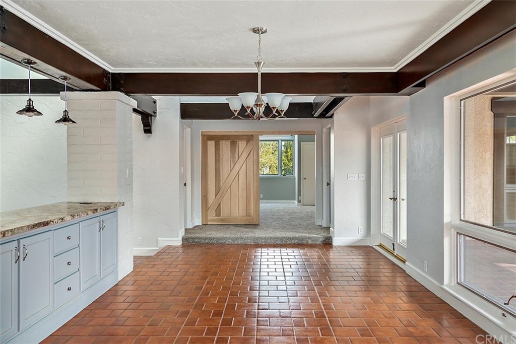 110 Nutwood Circle Paso Robles, CA 93446 - Photo 14 of 40 a view of a hallway with windows and chandelier