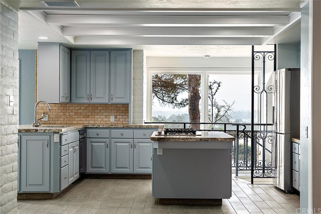 110 Nutwood Circle Paso Robles, CA 93446 - Photo 16 of 40 a kitchen with stainless steel appliances granite countertop a stove and a refrigerator