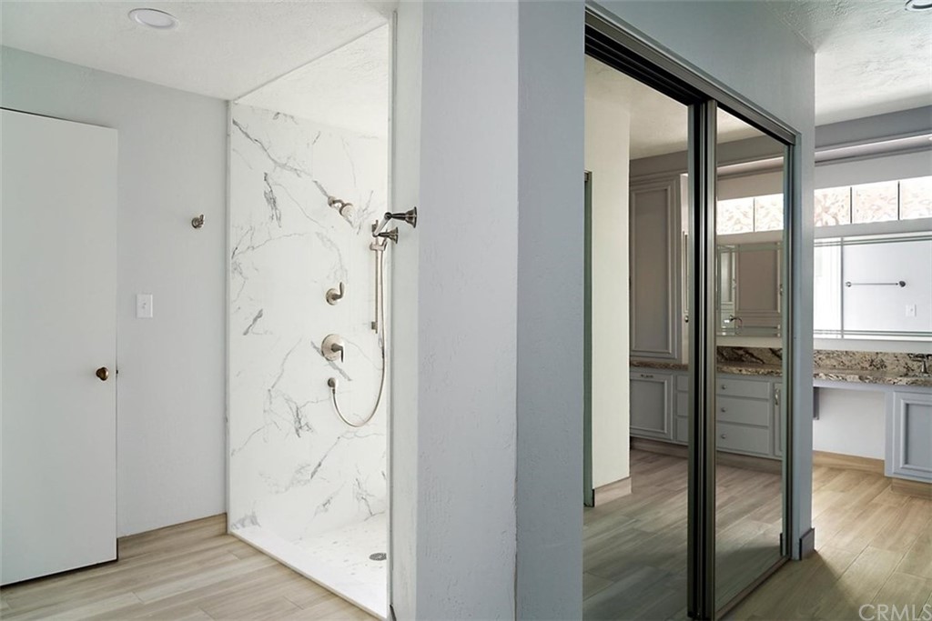 110 Nutwood Circle Paso Robles, CA 93446 - Photo 23 of 40 a bathroom with a glass shower door and a window