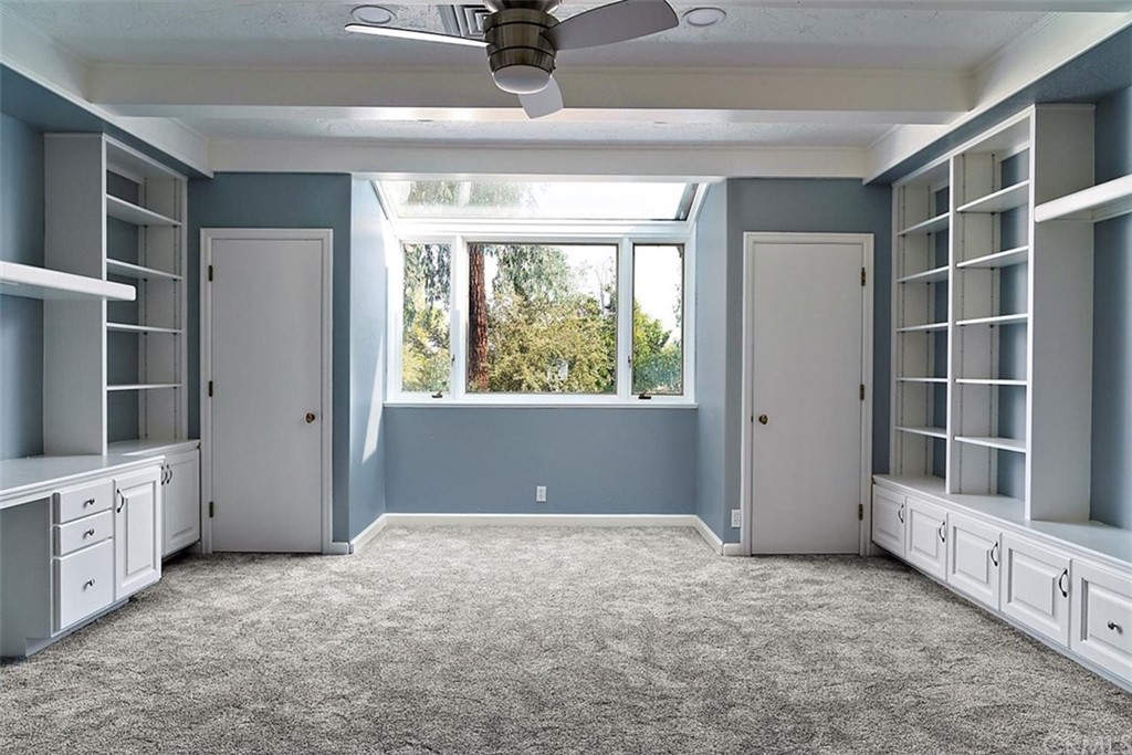 110 Nutwood Circle Paso Robles, CA 93446 - Photo 24 of 40 a view of an empty room with a window and a kitchen