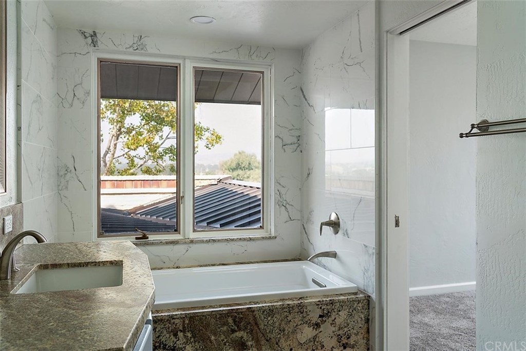 110 Nutwood Circle Paso Robles, CA 93446 - Photo 25 of 40 a bathroom with a tub and sink