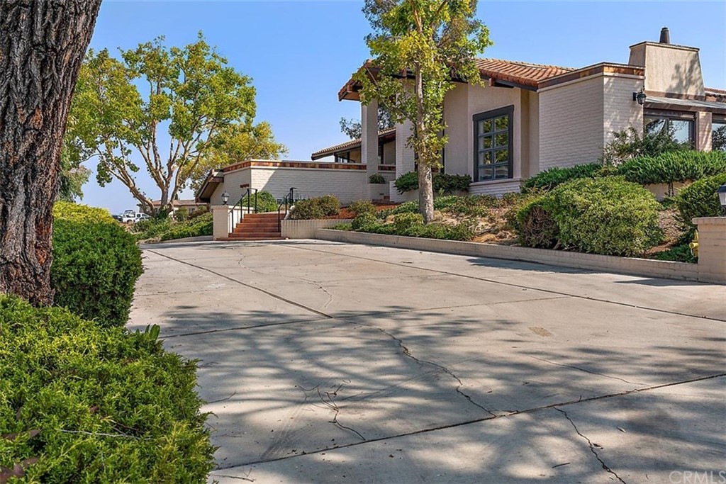 110 Nutwood Circle Paso Robles, CA 93446 - Photo 5 of 40 a front view of a house with a yard and a garage