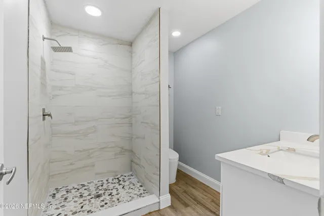 a bathroom with a sink and a shower